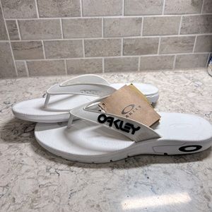 Oakley sandals/flip flops. All white. Mens size 11. Brand new with tags.